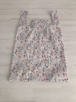 Bolsa plegable de tela rosas y lilas
